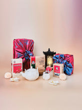 Lunar New Year Vitality Gift Set featuring pomegranate with Korean red ginseng, Pure 100 extract, and honey paste daily sticks displayed with a teapot, lantern and flowers